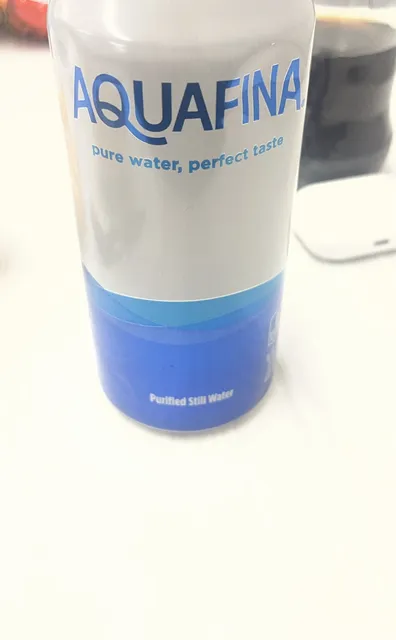 Aquafina Purified Still Water 16 fl oz (473 ml), front of pack