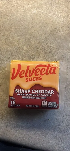 Velveeta Slices Sharp Cheddar 12 oz, front of pack