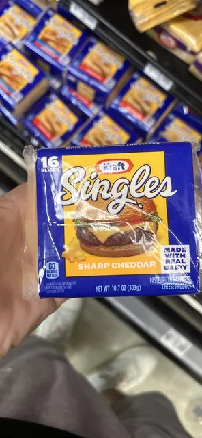 Kraft Singles Sharp Cheddar 16 Slices 10.7 oz, front of pack