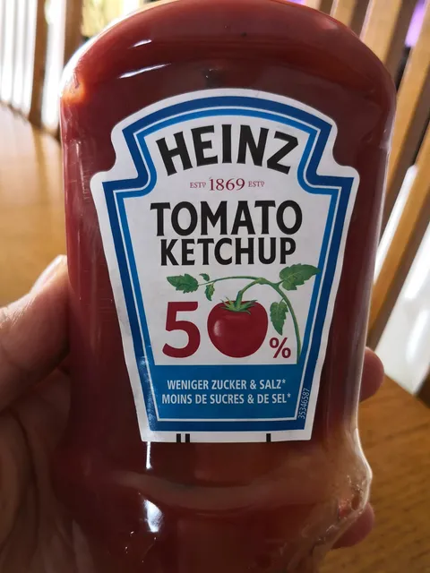 Heinz Tomato Ketchup 50% Less Sugar & Salt 435 g, front of pack